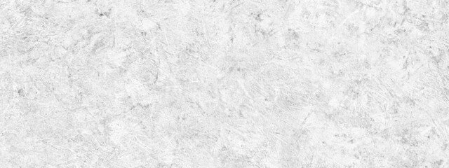Abstract light grey plastered textured grunge background, horizontal banner, in the form of a rough covered stucco wall, closeup