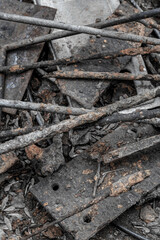 iron trash piled on the ground old and weathered vertically