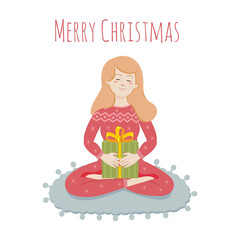 The girl holds a gift in her hands in the lotus position. Greeting card for the new year and christmas.