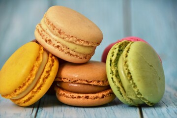 sweet macaron dessert on wood blue background
