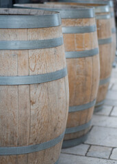 Row of old oak wooden casks