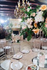 decor of fresh flowers in the restaurant for a wedding banquet.