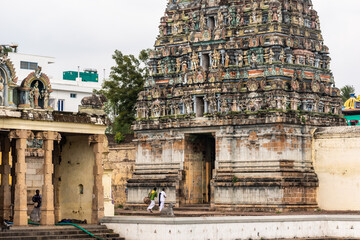 The facade of the weathered gopuram tower of the ancient Hindu Sattainathar temple in the town of...