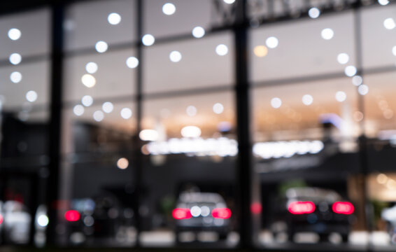 Blurred Background With Car Dealership Exterior. Abstract Blurred Photo Of Modern Building Motor Showroom. Blur Car Show Room Office Bokeh Lights. Automobile Retail Shop