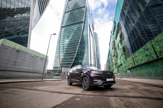 moscow, russia - march 18, 2020: new chineese urban family SUV chery tiggo 8 plus in downtown center of metropolis Moscow city. china new flagship car in city jungle