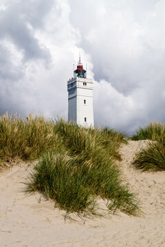 Lighthouse under cloudy sky