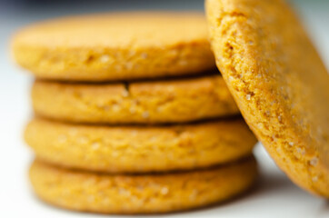 Close up on a stack of cinnamon oat cookies on a white background