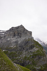 Fototapeta premium Amazing hiking day in the hearth of Switzerland. Wonderful scenery while climbing the summit and watching over the alps. Epic landscape.