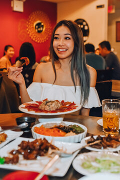 Woman eating dinner at a restaurant