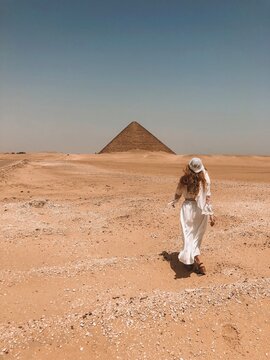 Woman walking toward Pyramid