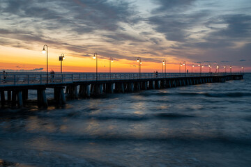 Fototapeta na wymiar Wooden Pier in Gdynia Orlowo during the spectacular sunrise