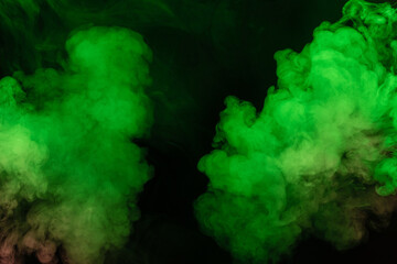 Green and pink steam on a black background.