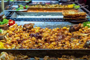 street food festival potato and pork roast selective focus