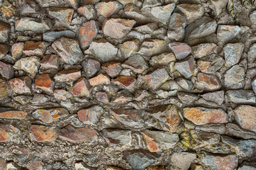 old stone wall weathered uneven part of the fort wall