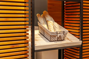 Bread exhibitor in a bakery. Fresh bread ready to eat.