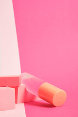 a bottle of perfume on a bright colorful background, a mockup of a bottle of perfume on a pink background