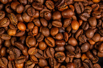 Natural background for Cafe menu or brochure template - macro photo of brown roasted coffee beans, close up