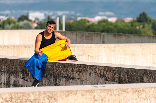 Cheerful colombian male wearing colombian flag 