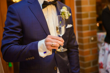 first toast of the bride and groom with a glass of champagne.