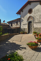 Exterior of the Church of the Holy Crucifix in the old village of Castagneto Carducci in summer, Livorno, Tuscany, Italy