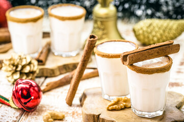 small doses of warm Christmas eggnog, based on eggs and rum liqueur. called eggnog, momo cola, coquito or Crème de Vie