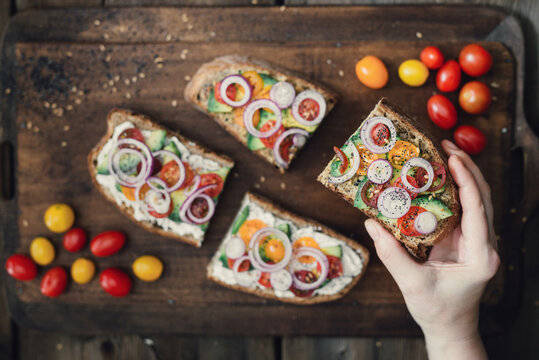 Vegetarian sandwiches toasts with avocado and cherry tomatoes