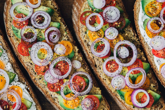 Vegetarian sandwiches toasts with avocado and cherry tomatoes