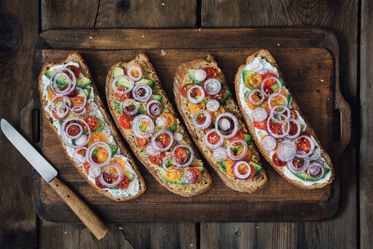 Vegetarian sandwiches toasts with avocado and cherry tomatoes