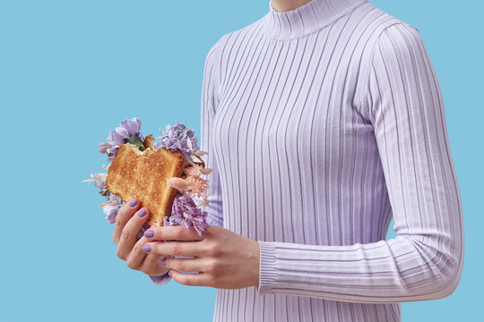 Woman with bitten flower sandwich