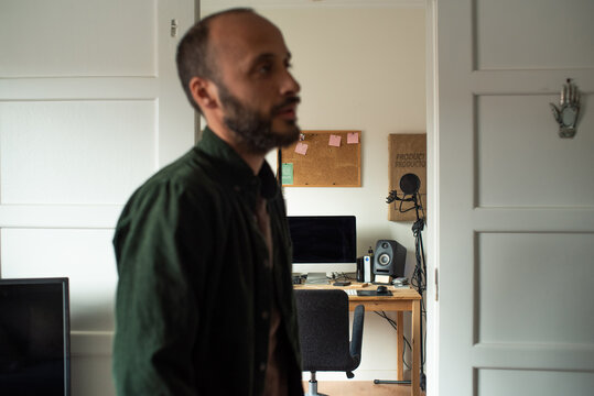 Man standing in his home and talking