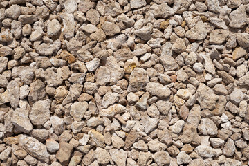 The road strewn with granite rubble as a background.