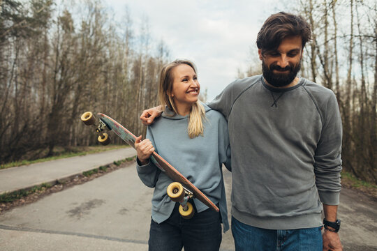 Man and woman with skateboard
