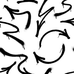 Black arrows made from spray paint on white background. Vector seamless pattern