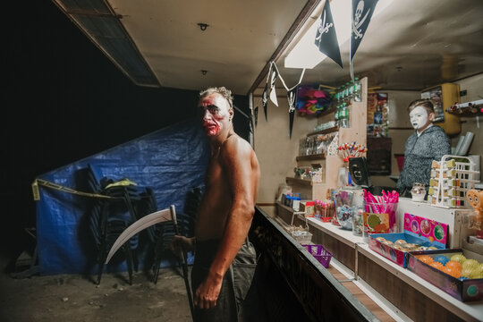 Circus Artist Near To Kiosk With Sweets

