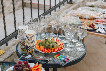 Fresh fruits among glass glasses