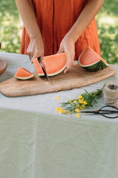 Anonymous Woman Slicing Watermelon For Vegan Appetizer 