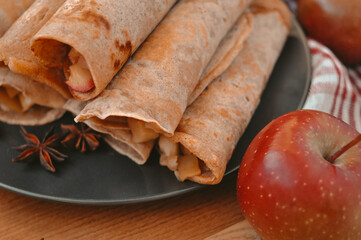 Rolled pancakes with apple cinnamon and honey 