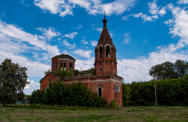 Fototapeta na wymiar A church in the midst of dense grass. An abandoned church in Tatarstan, Russia. 