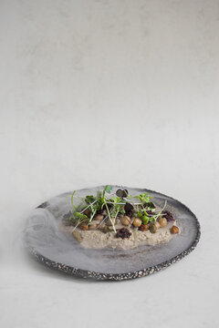 Food: Consome of Ceps, pumpkin gnochi and black beans