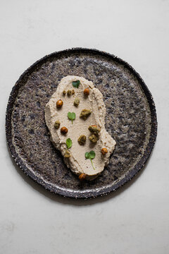 Food: Consome of Ceps, pumpkin gnochi and black beans