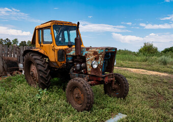 An old tractor in the countryside, Agricultural machinery. 