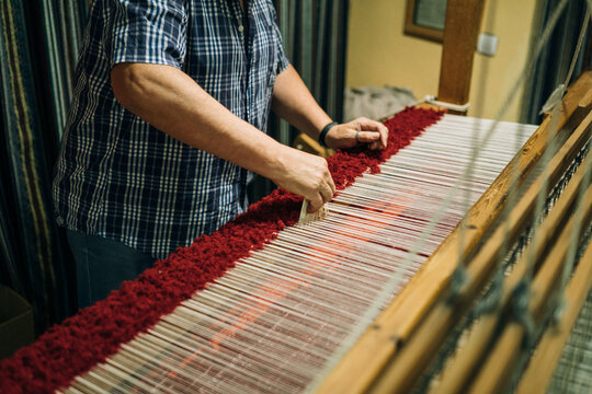 A Craftsman Hands Working in the Warp