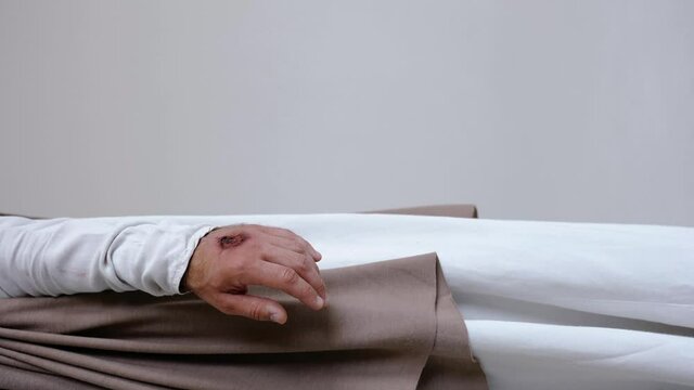 Jesus' hands with stigmata on a white background. Studio. Vertical. High quality 4k footage