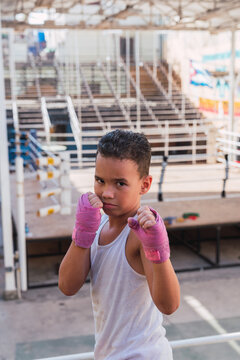 Serious teen in pink hand bandage looking at camera