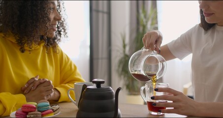friends having breakfast and drinking coffee