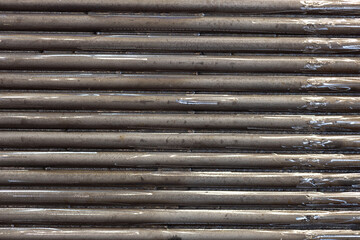 Obraz premium metal background. industrial background from horizontal pipes welded to each other