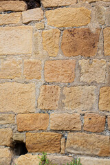 sandstone brick wall, background, close-up. Eco-friendly construction.