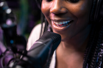 Woman speaking into a studio microphone
