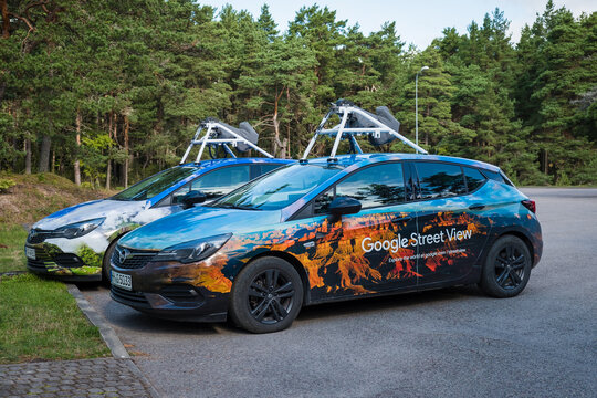 Saaremaa, Estonia - August 24, 2021: Two Google Street View cars parked in rural location. Google map vehicles are mapping roads worldwide.