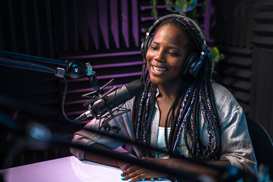 Smiling podcast host speaking